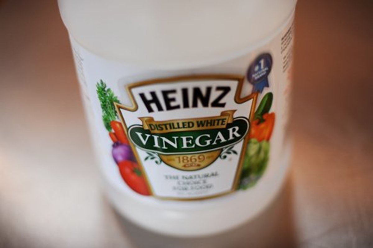 That bottle of white vinegar in your kitchen cabinet is the best product to clean a Keurig coffee maker resevoir.