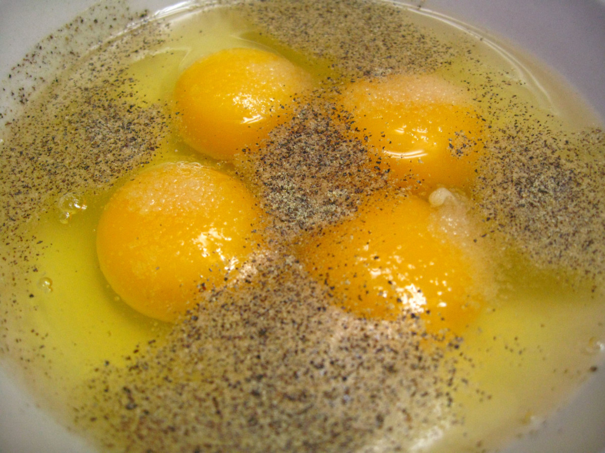 In a bowl, whisk the eggs, Parmesan cheese, salt and pepper. 