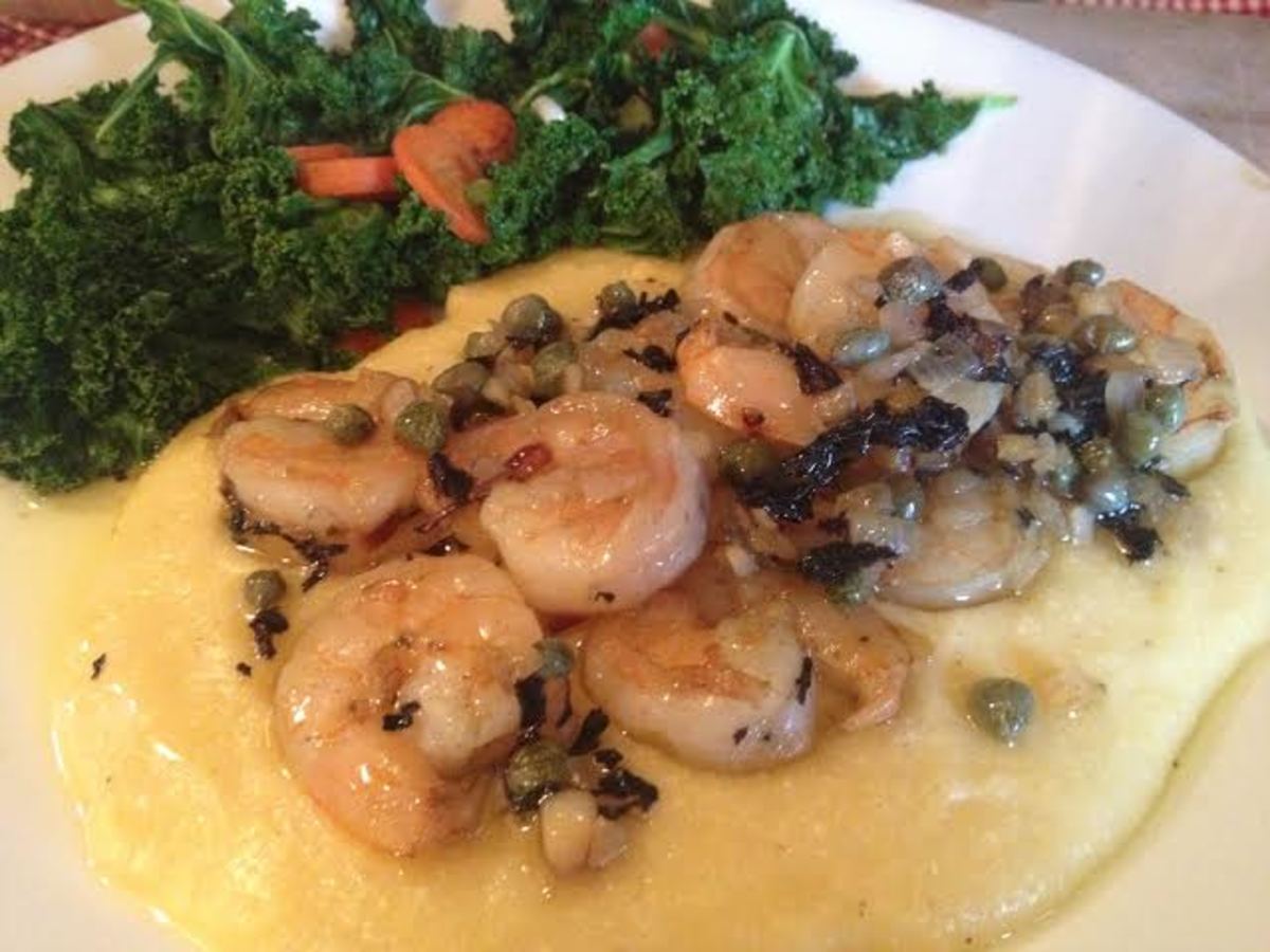 The beautiful kale side dish complimenting a dinner of parmesan polenta with garlic, capers, and shrimp.