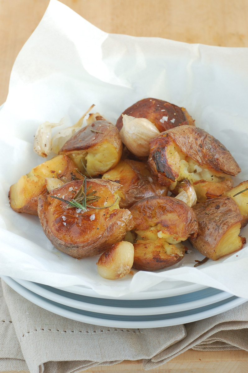 Oven-roasted potatoes and garlic cloves pair well together.