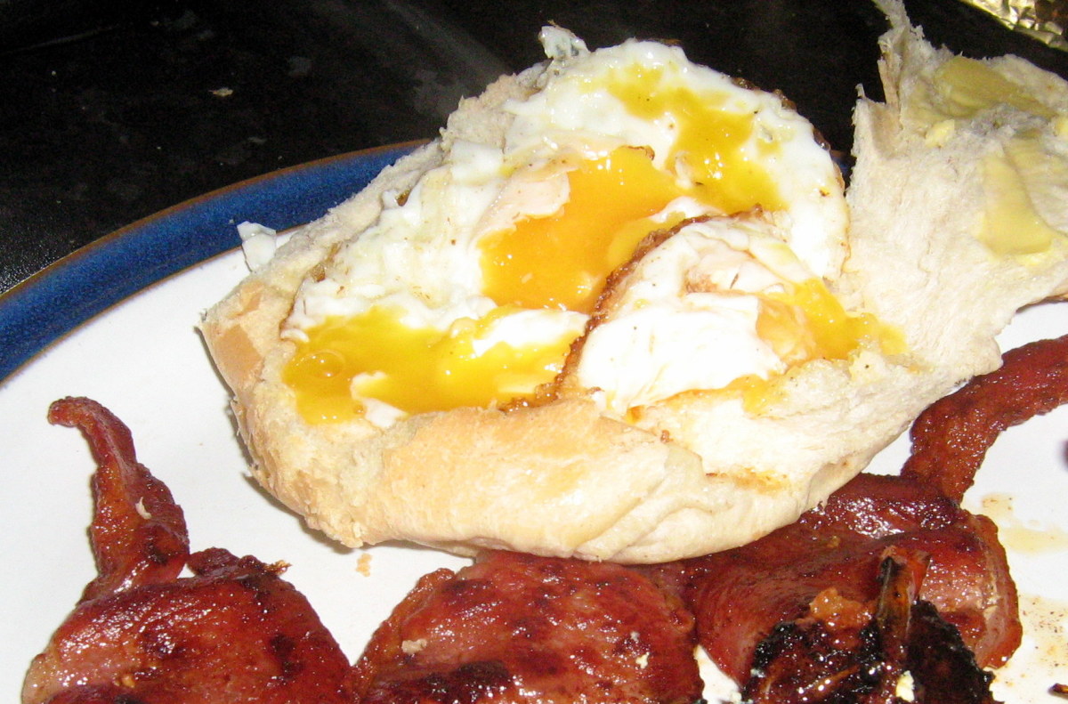 Tasty fried egg sandwich with bacon