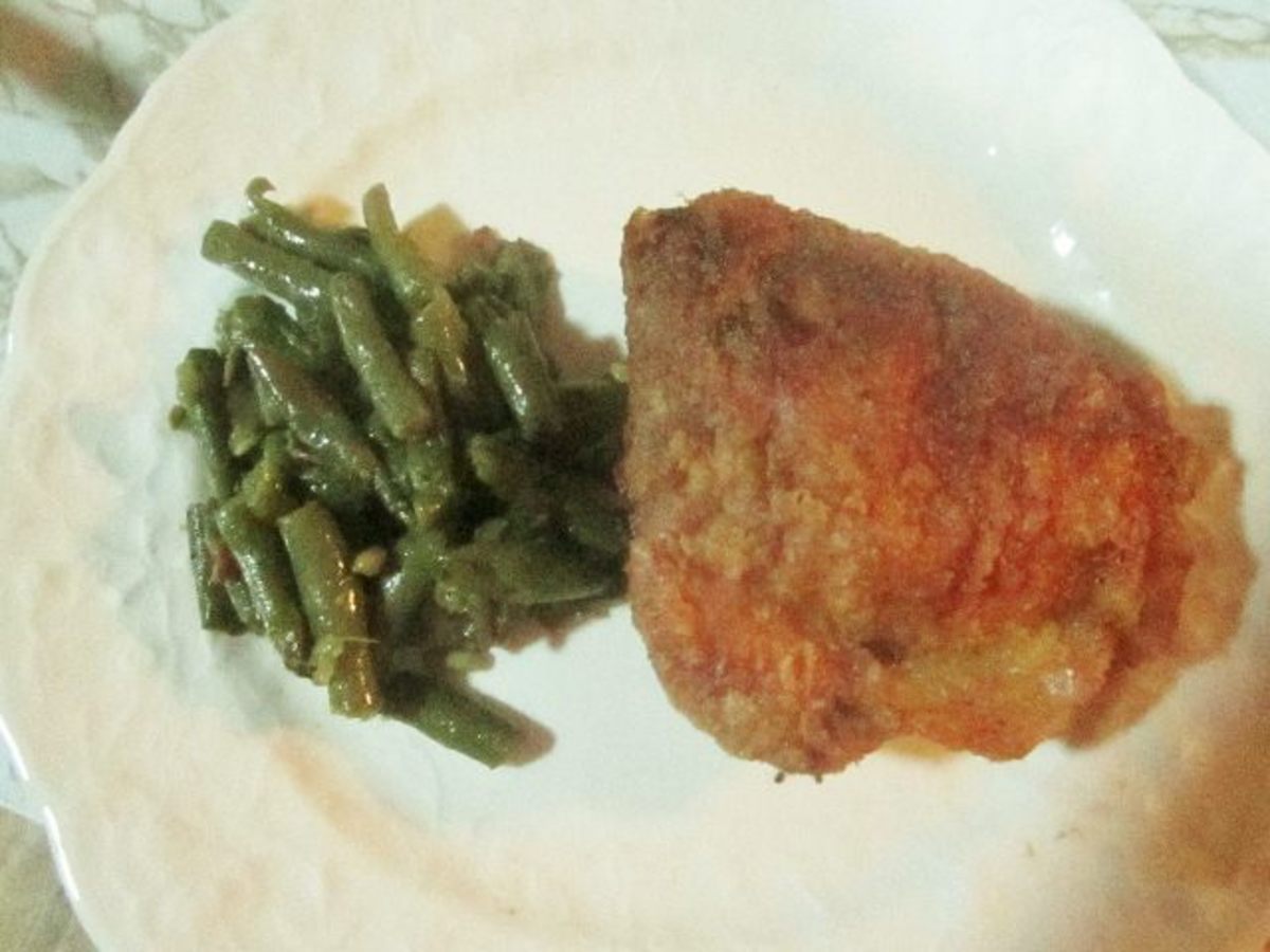 I love my specially made homemade green beans recipe served with my own fried chicken.