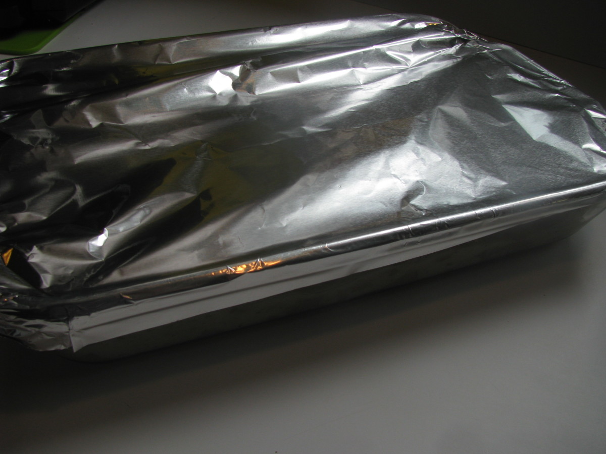 Cover chicken dinner baking dish with foil and bake.