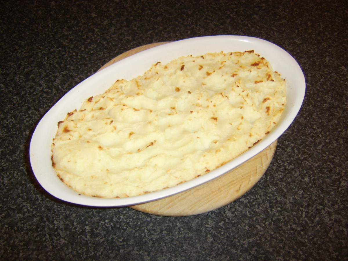 Ling and vegetables are combined in a creamy white sauce and topped with fluffy mashed potato