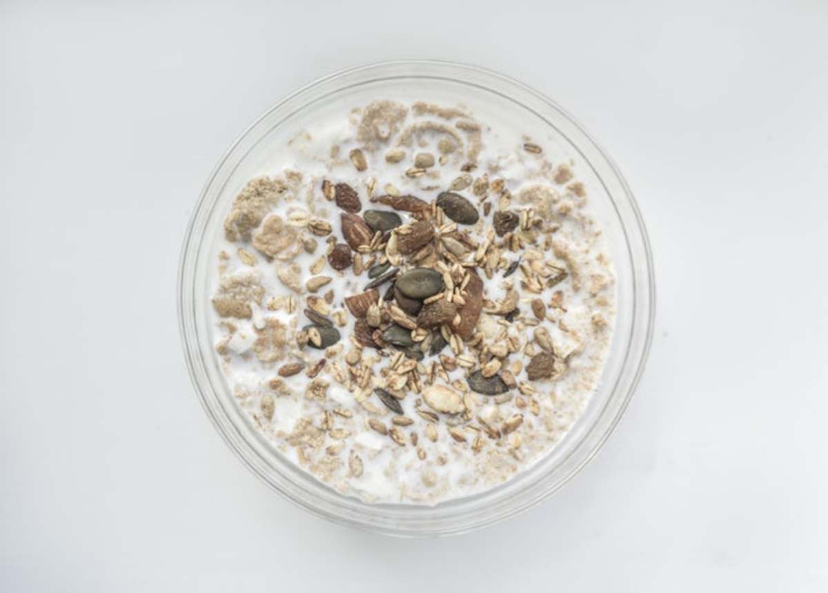 Oatmeal with milk and fruit provides complex carbs and fiber.