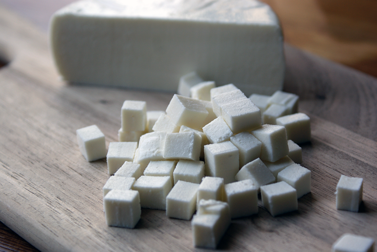 Queso fresco wheel and cubes.