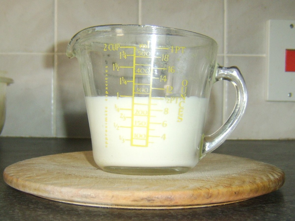 Measuring out the yoghurt and milk for soda bread.