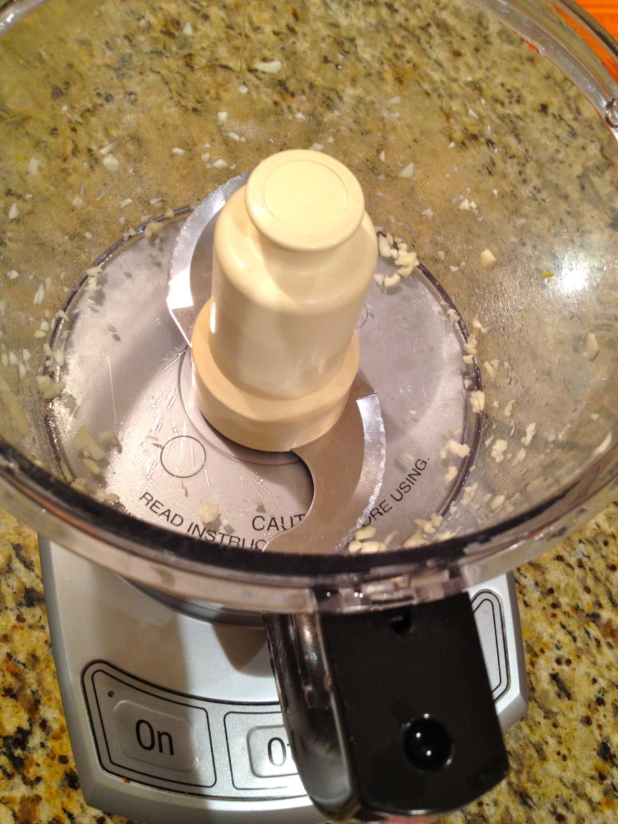 Chop garlic cloves in food processor for about 30 seconds.