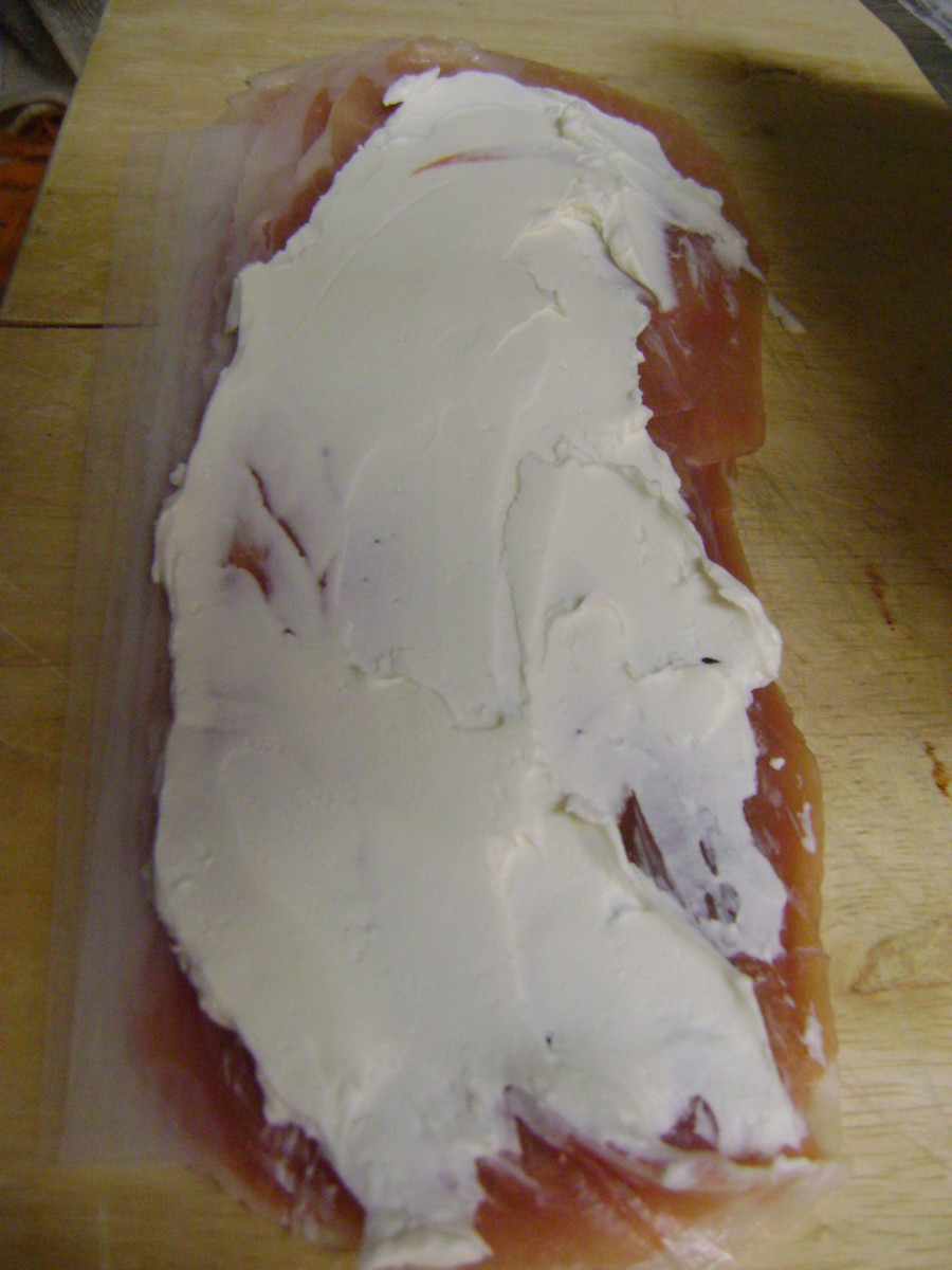 Spread 1 tablespoon of softened cream cheese on each slice of dried beef.