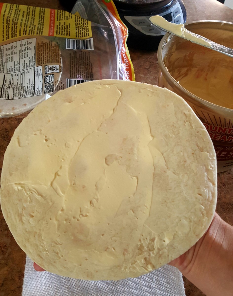 Generously butter one side of your tortilla before placing it in the frying pan.