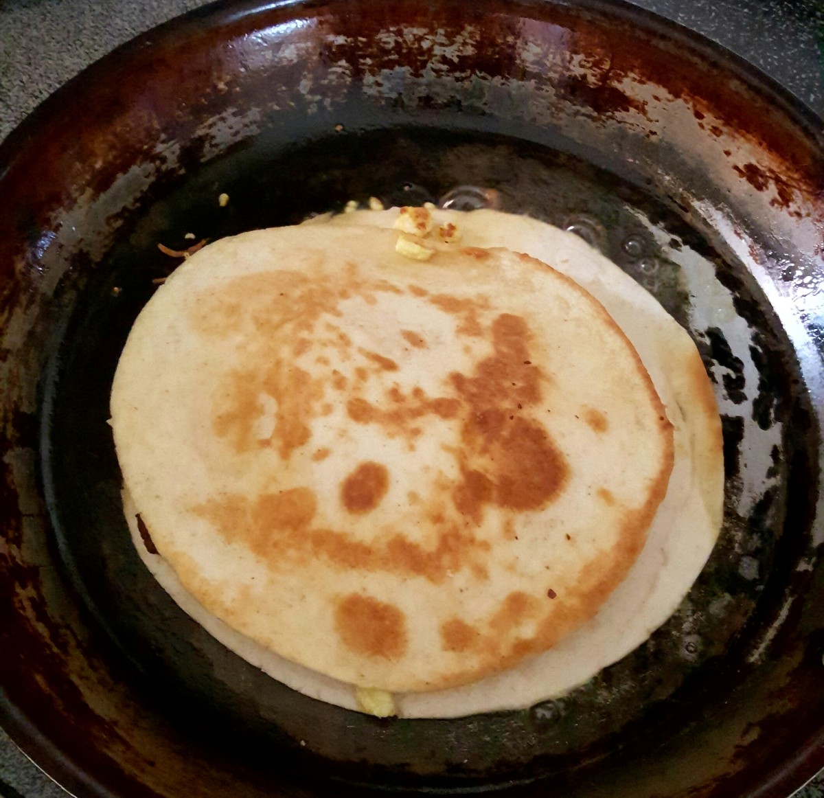 After cooking for a few minutes, flip your quesadilla. Continue cooking for a few more minutes to brown the other side.