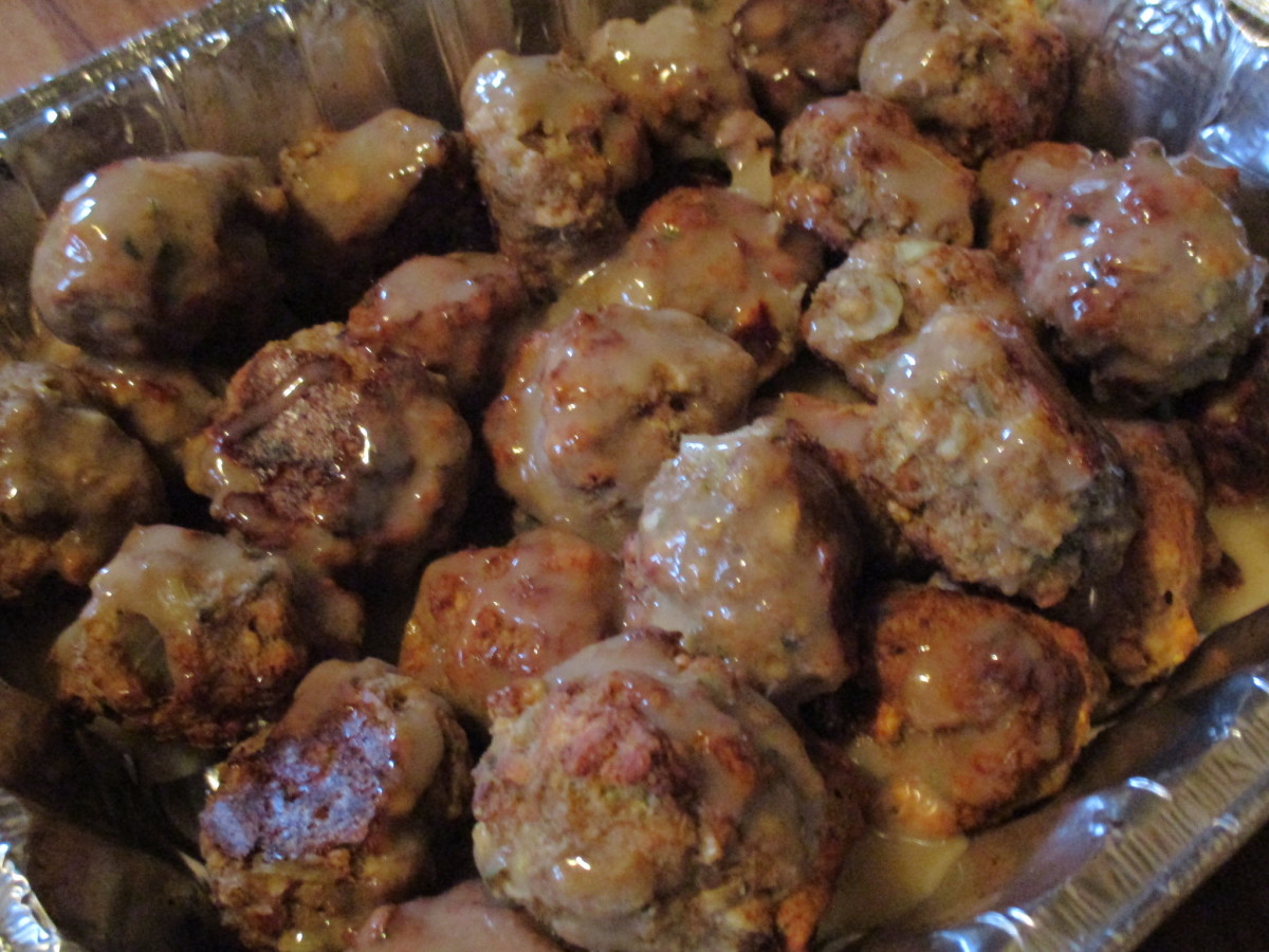 Meatballs with gravy on them.