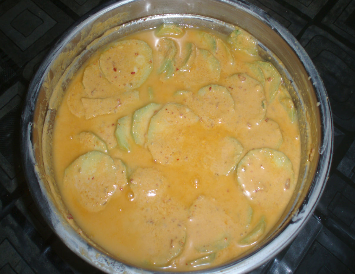 Ridge gourd slices dipped in the batter.