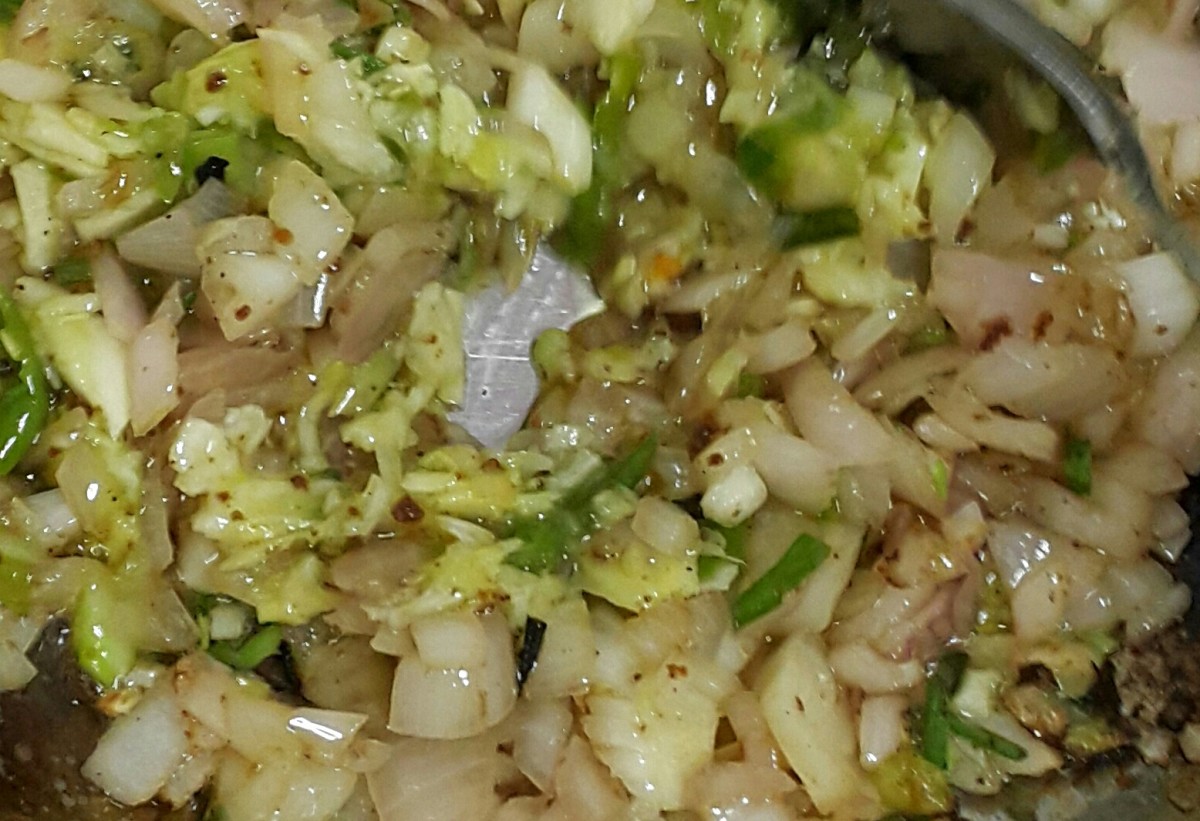 Onions, ginger-garlic-chilly paste and spring onions sauteed. 