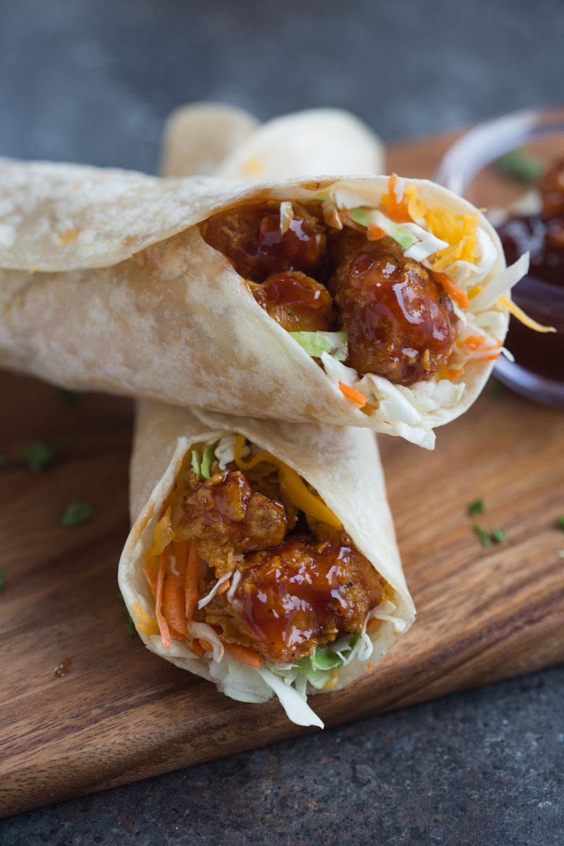 A honey BBQ chicken wrap with veggies and melty cheese.