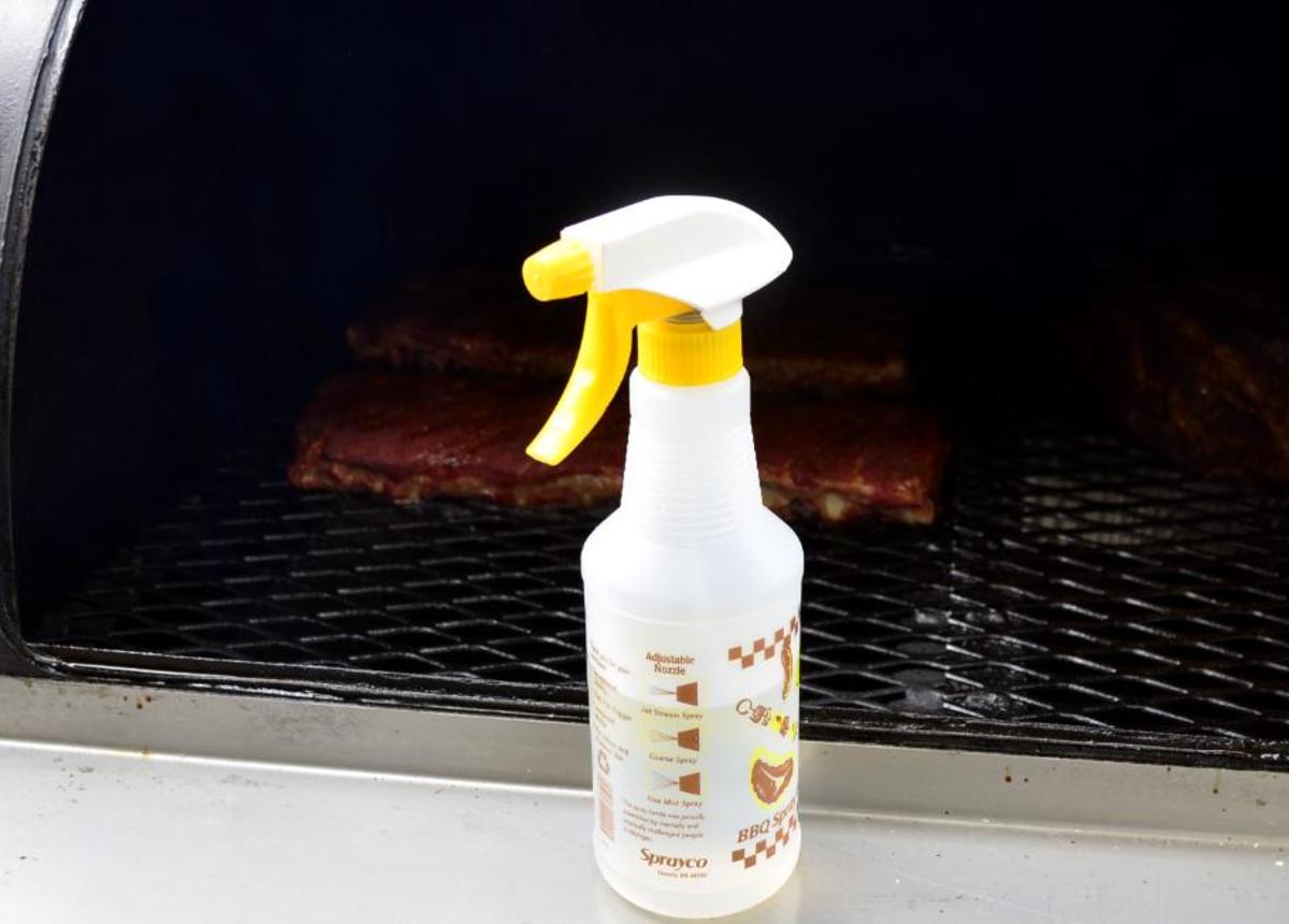 A spray bottle can be used to apply basting sauce to the meat while on the smoker.