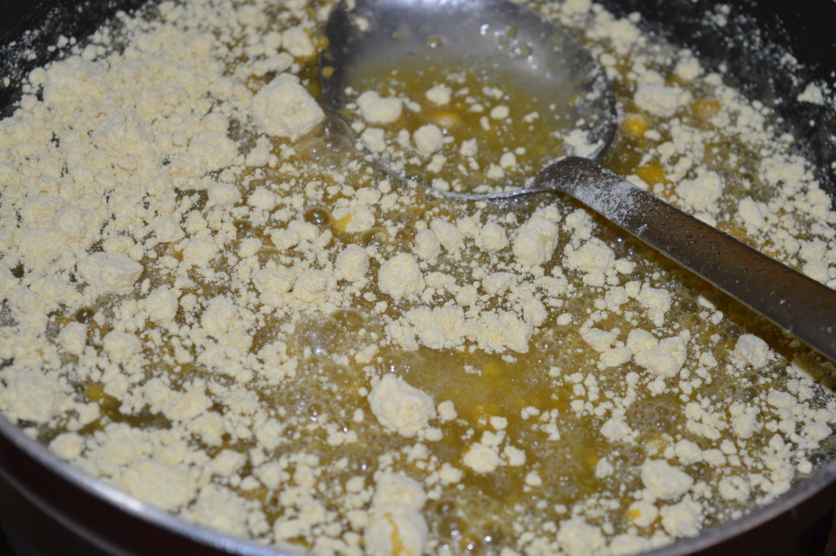 Step 4: Add some gram flour, and stir the mix continuously.