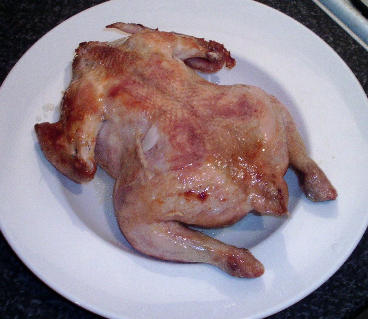 Roast chicken is left to rest