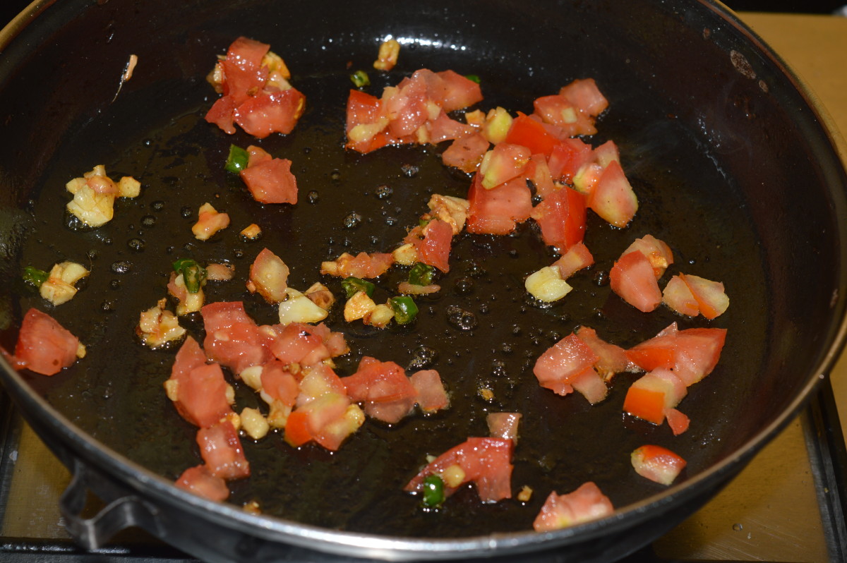 Stir-cook on high flame for 2 minutes or till tomatoes become soft yet retain crunchiness.