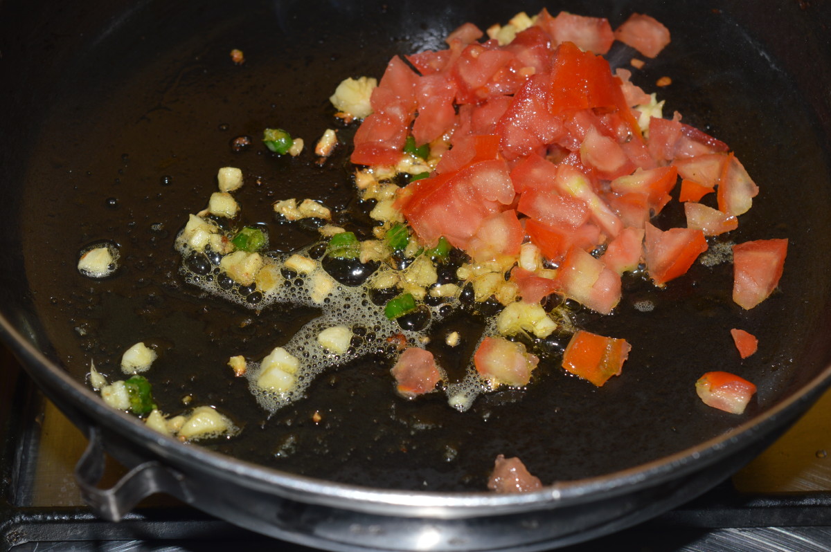 Step 3: Add chopped tomatoes. 