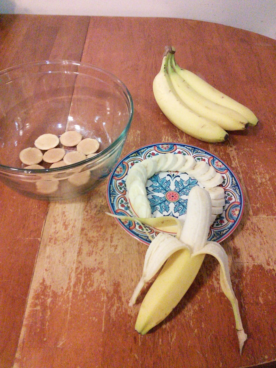 Get your vanilla wafers and bananas. I used 3 bananas. You can use as many or as little as you would like. Slice them into 1/2-1 inch pieces. Start your layers. I prefer to put wafers on the bottom so the pudding can soak into the wafers. 