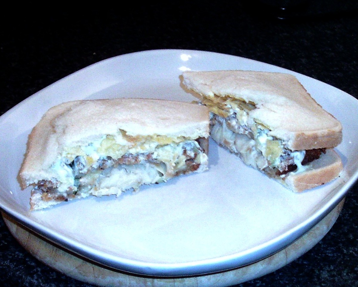 Breaded cod fillet with tzatziki sauce and salt and vinegar crisps sandwich