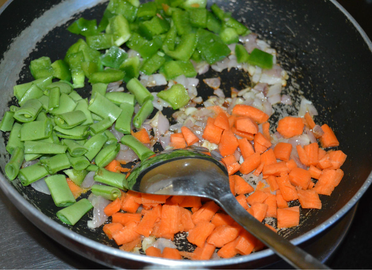 Step three: Add chopped veggies and some salt. 