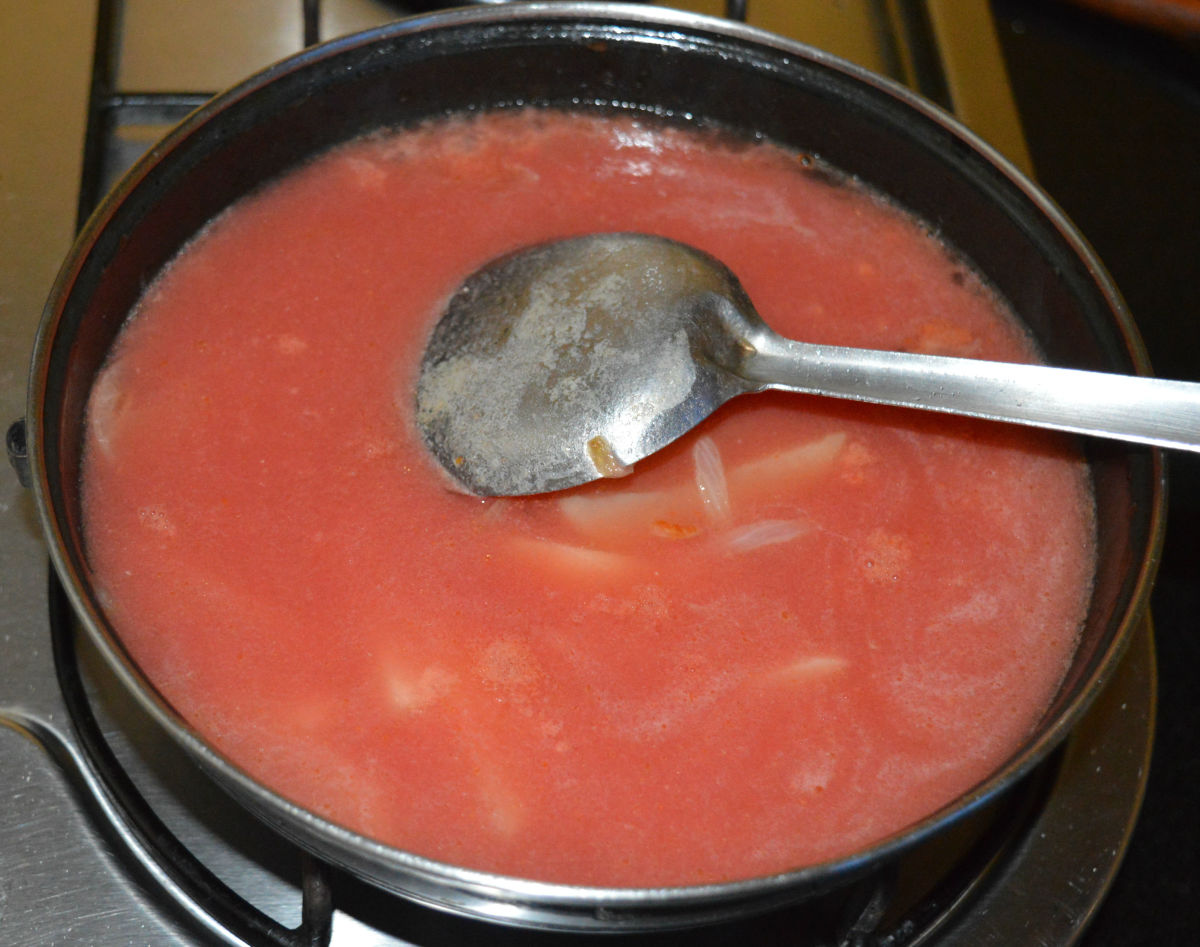 Step five: Add tomato puree. Add 3-4 cups of water.