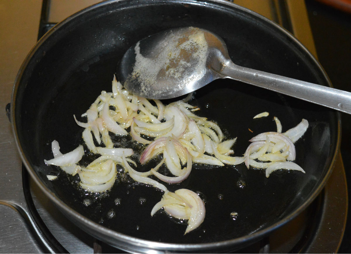 Step three: Saute thinly sliced onions in butter or olive oil until golden.