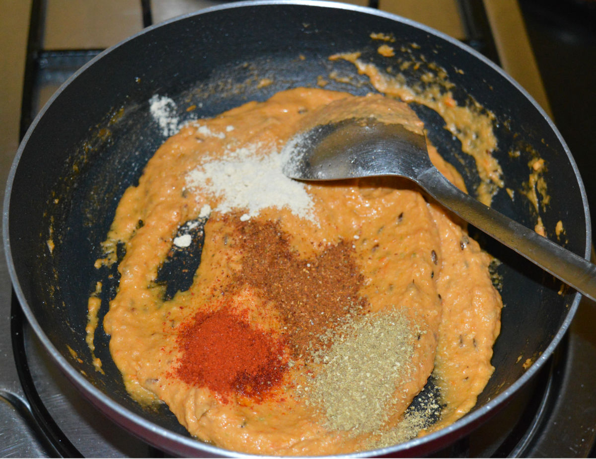Step three: Add red chili powder, garam masala powder, turmeric powder, dry mango powder, coriander powder, salt, and sugar. Saute the mix for a minute.