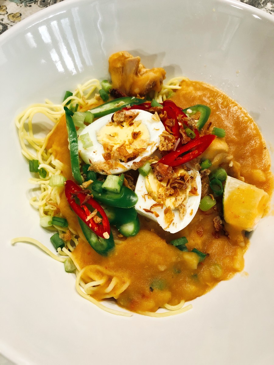 Mi rebus, or boiled noodles, is a very popular dish in Malaysia. Yellow noodles are served with a thick, spicy potato-based gravy that is garnished with a hard-boiled egg, spring onions, fried shallots, and Asian red and green chilies.