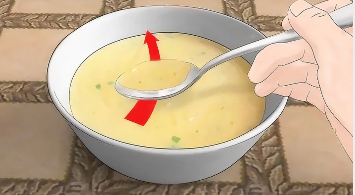 This is the way to eat soup by filling the spoon by pushing it away from you.