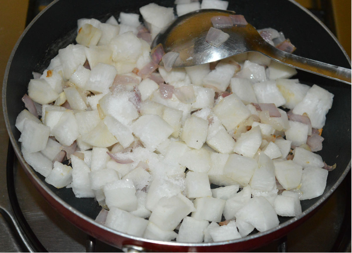 Step 4: Add chopped radish and some salt. Saute for 1 minute. Next, add 1/2 cup of water. Cover the pan and cook for 6-7 minutes or until radish becomes soft.
