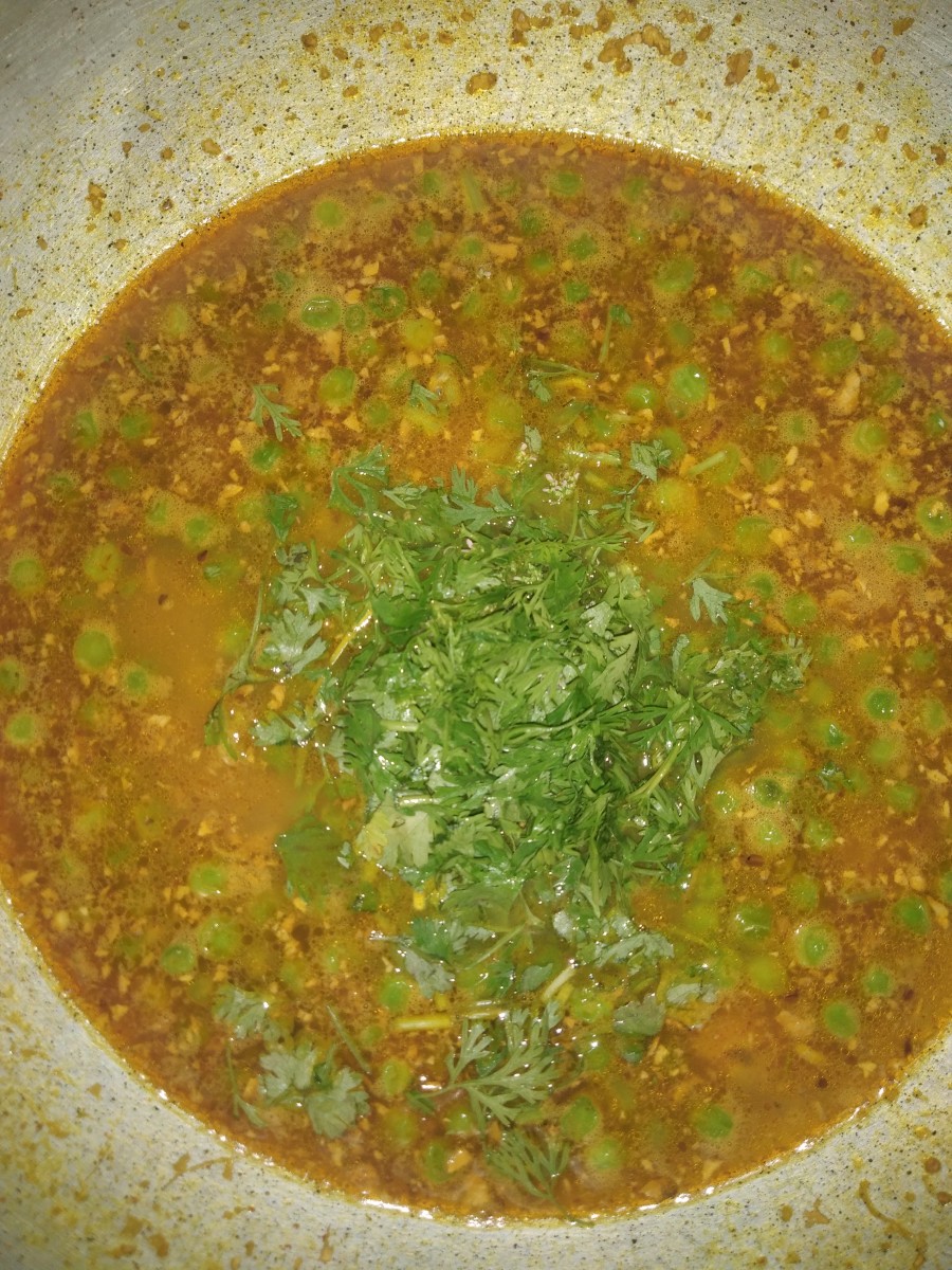 Sprinkle garam masala powder, stir, and garnish with coriander leaves.
