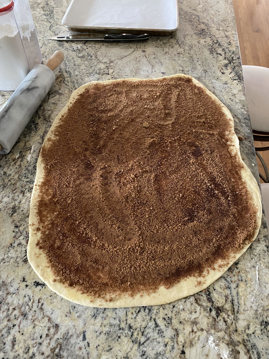 Spread the melted dairy-free butter over the surface of the dough with your brush. Sprinkle the brown sugar and cinnamon mixture heavily across the dough.