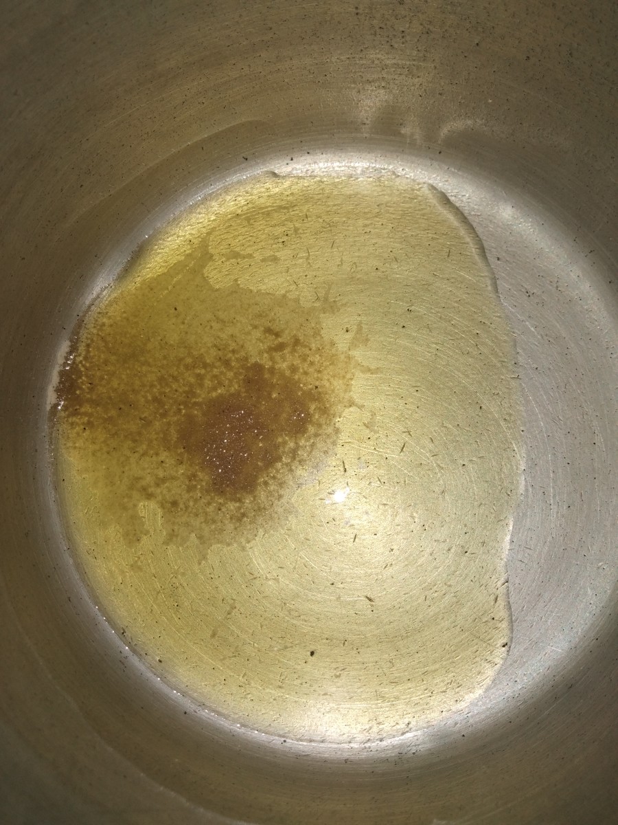 In a cooker, heat oil or ghee. Add asafoetida.
