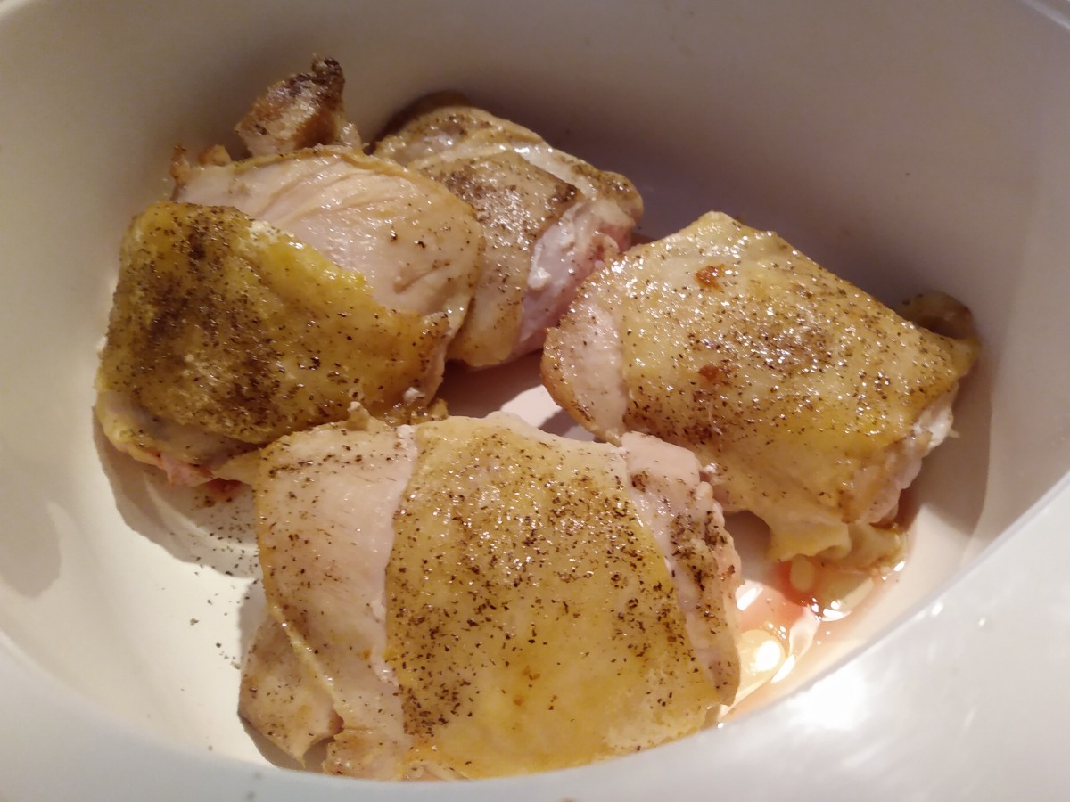 Chicken thighs have been browned on each side. They will finish cooking in the oven. 