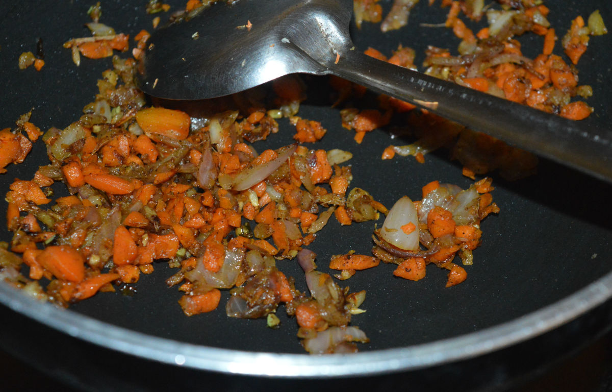 Throw in chopped carrots, pepper powder, and some salt. Continue to saute the mixture for 2 more minutes.