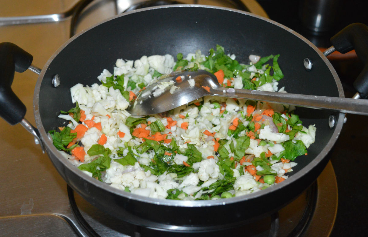 Add the chopped vegetables. Add some salt. Mix well.