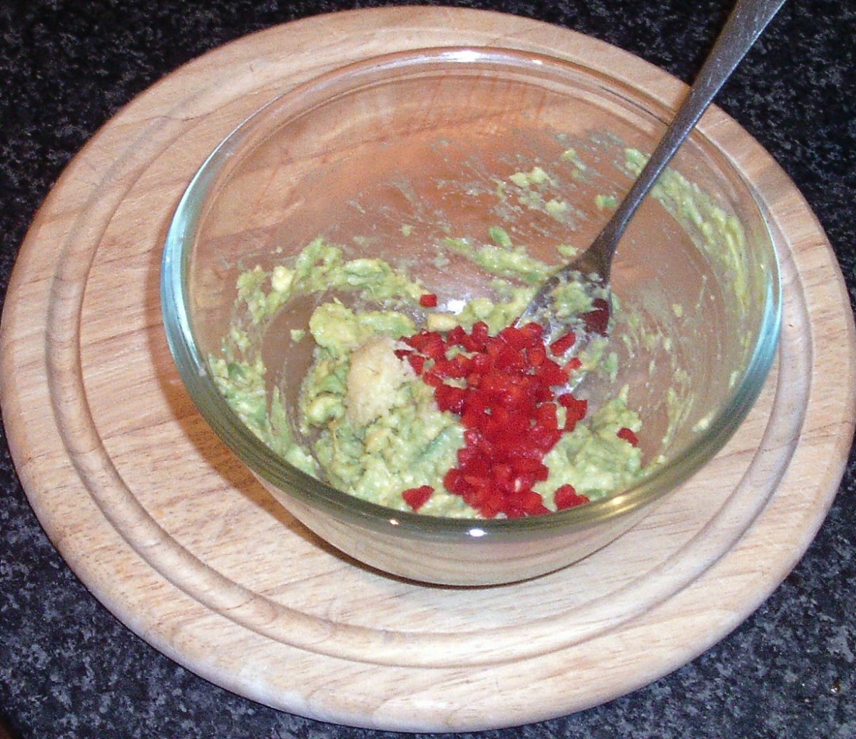 Guacamole ingredients are combined in a bowl