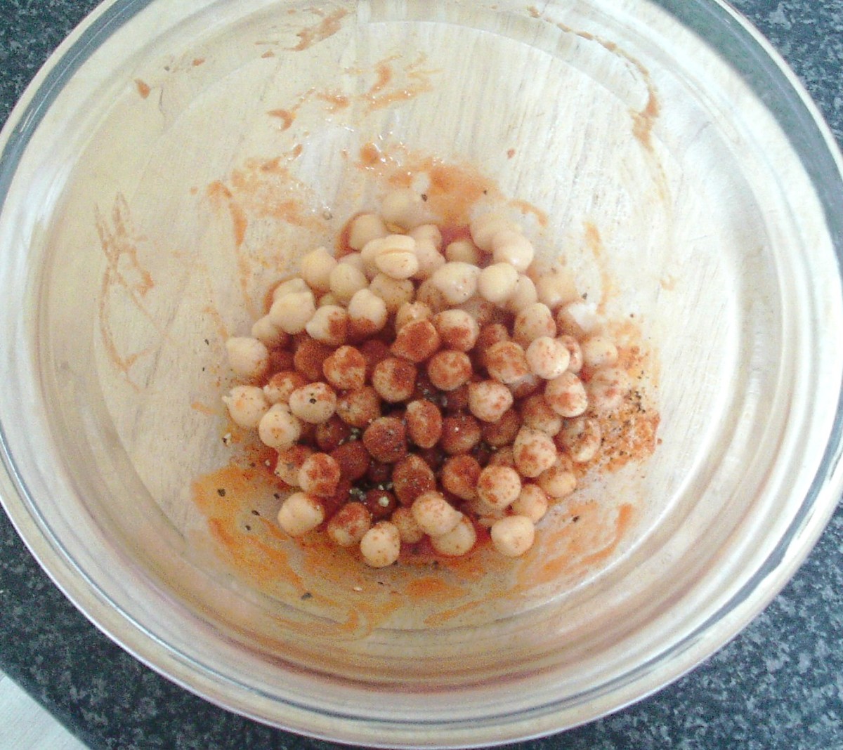 Chickpeas are seasoned and stirred in to tomato sauce