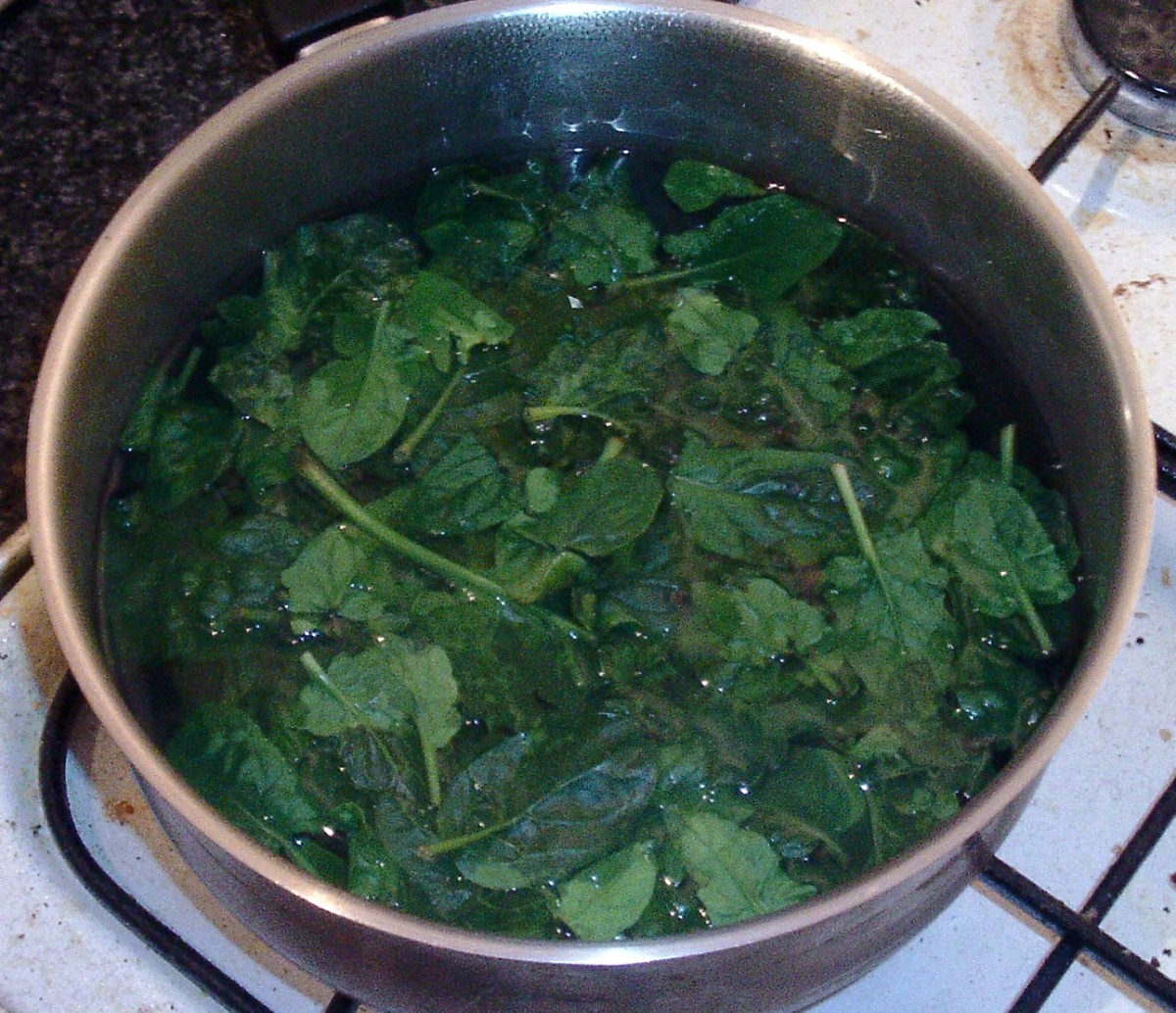 Spinach is blanched in boiling salted water