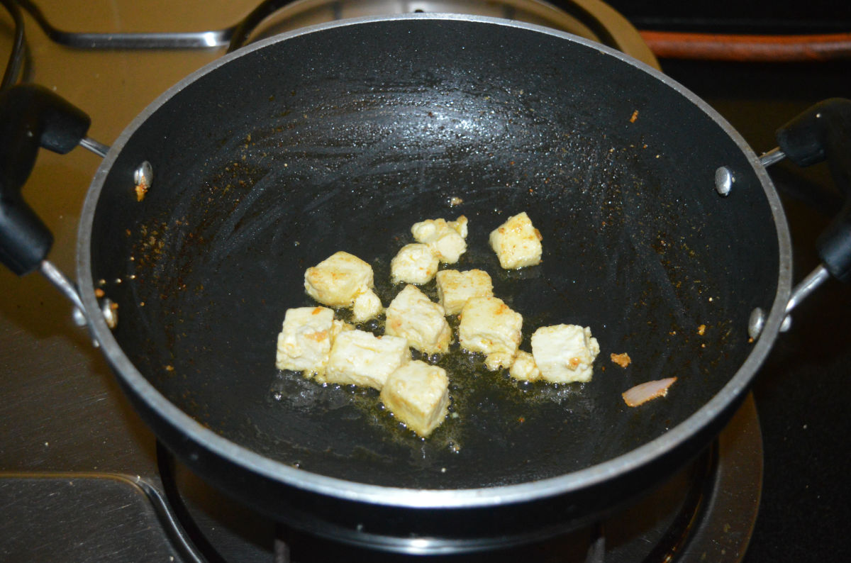Step one: Heat a deep-bottomed pan. Saute the paneer cubes in some oil until they become light brown. Transfer them into a bowl and set aside. Saute the raisins for a few seconds. Set aside.