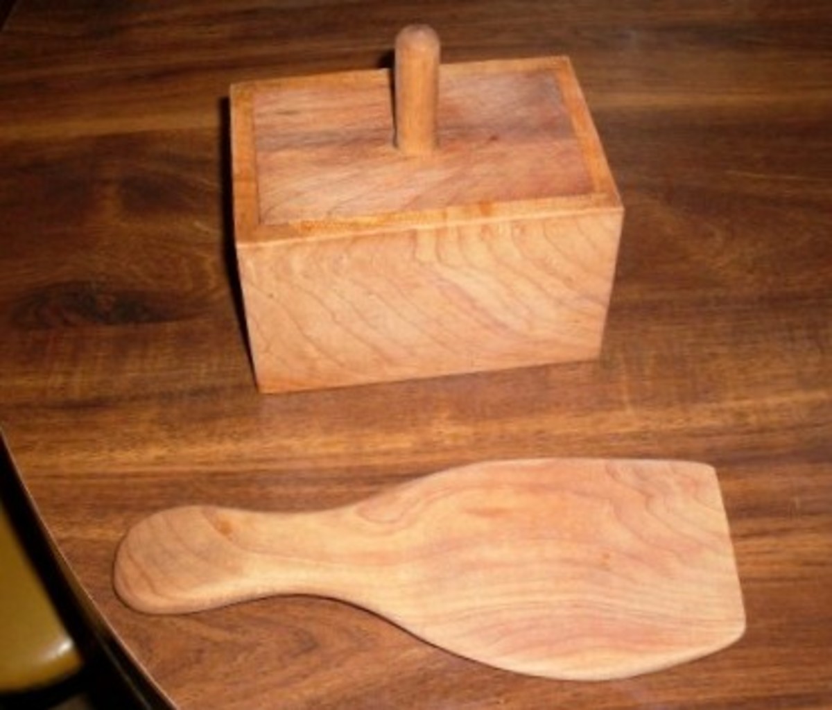 A one-pound butter mold that my father made, and a butter paddle, which is also his work.