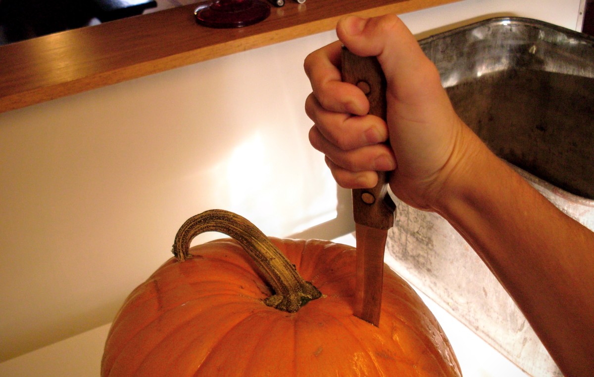 Begin by cutting a slit in the pumpkin near the stem. You may have to stab hard. Make sure your knife is very sharp.