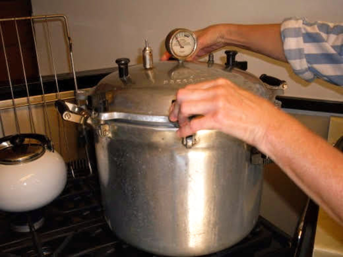 Screw or fasten the lid in place. On old-style canners, screw knobs down tightly in opposites to achieve an even seal.