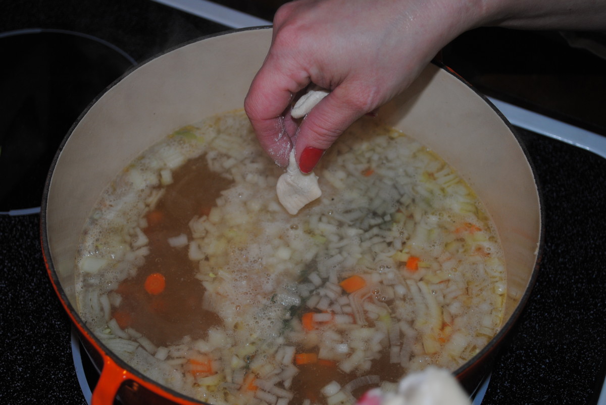 Drop the dumplings into the simmering broth one at a time. They'll stick together if you drop a big bunch in at once. You'll have a dumpling wad. So one at a time.