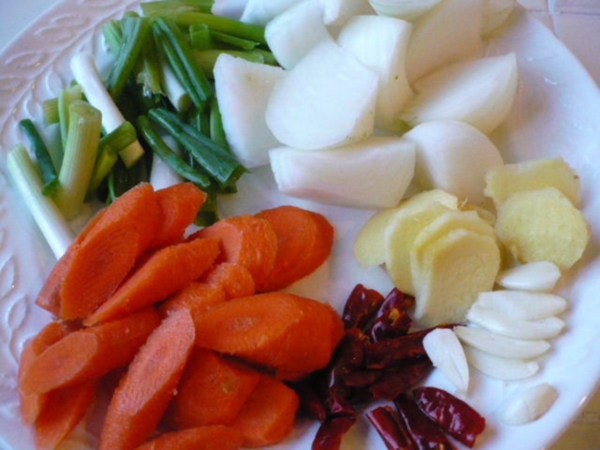 Since stir-frying is fast, it is essential to get all the basic ingredients ready before the actual stir-frying. Did you guess correctly? Carrots, scallions, diced ginger, garlic, onion and dried red chili pods