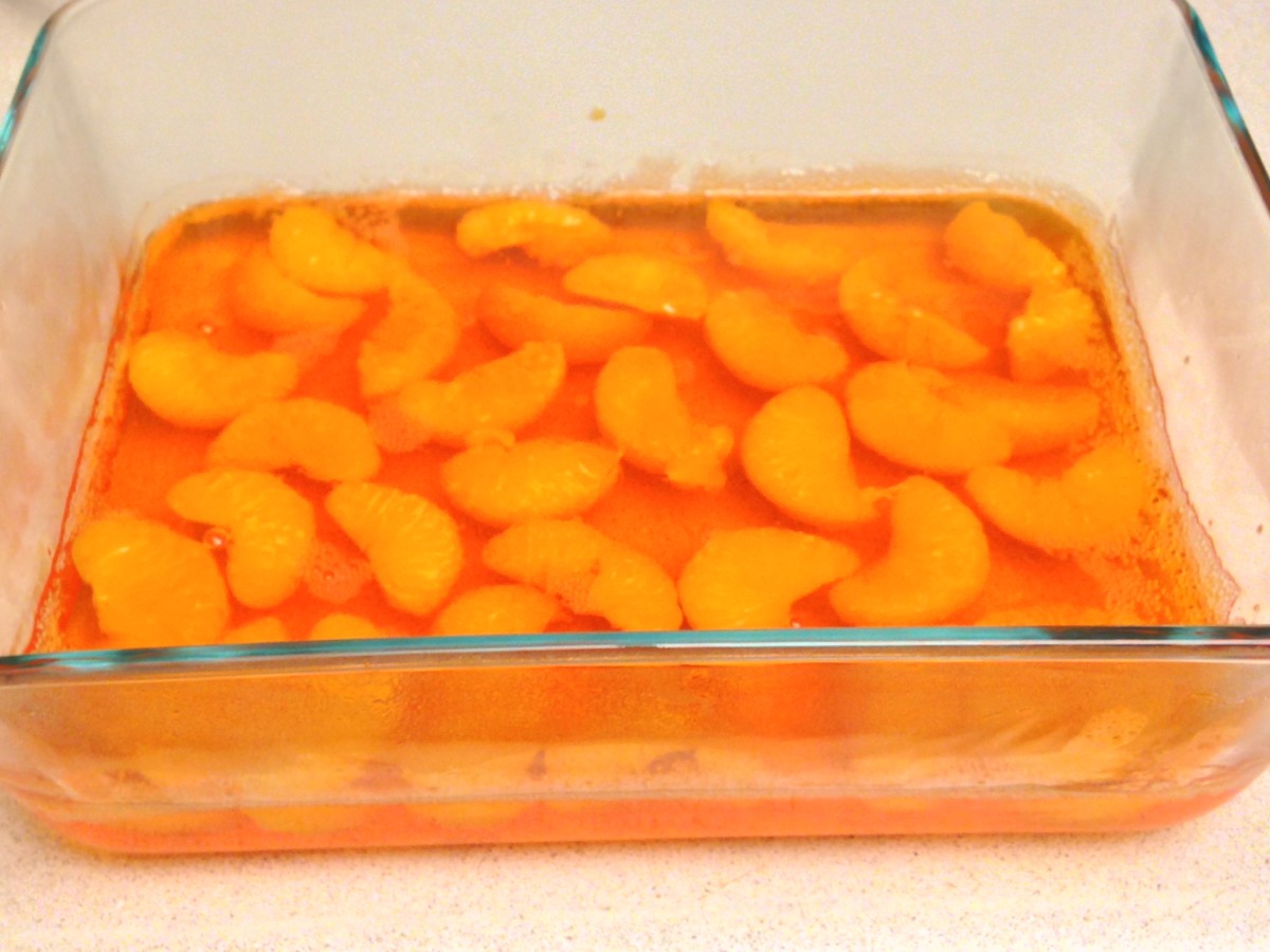 Prepare orange Jell-O. Chill 1–2 hours before dropping mandarin slices in.