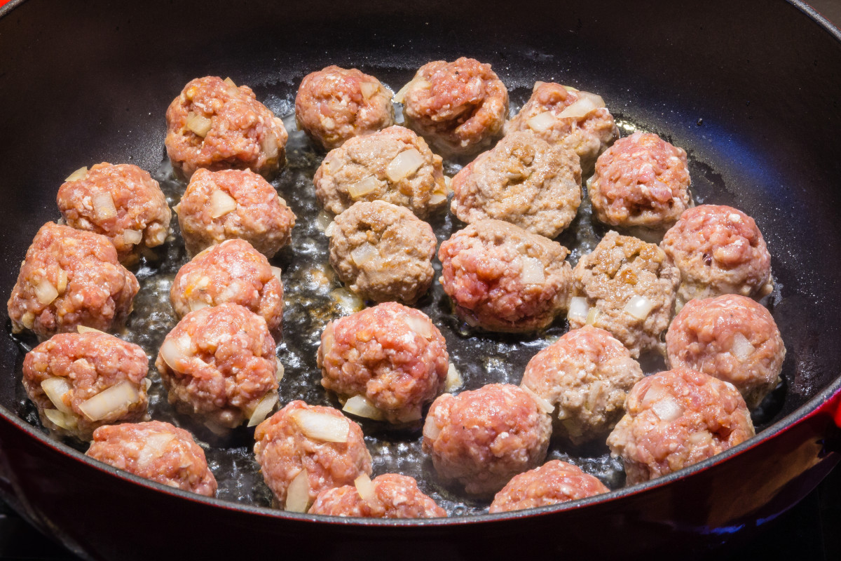 Homemade meatballs cooking in a pan